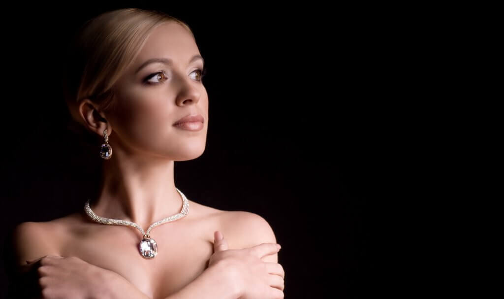 young woman with makeup in luxury jewelry