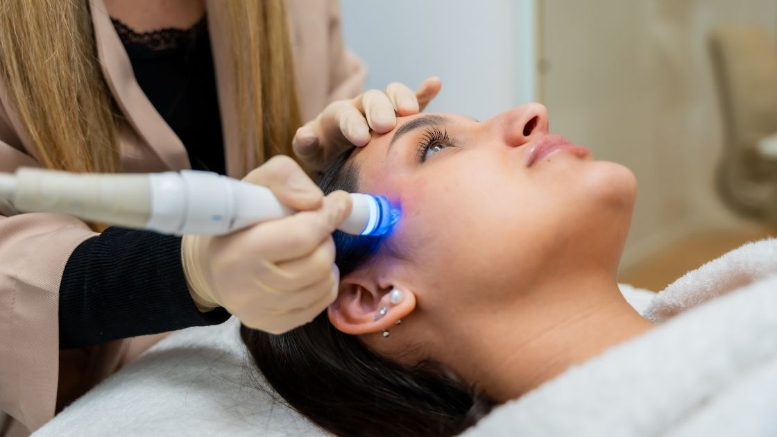 woman receiving advanced facial skincare treatment diamondglow